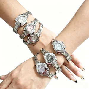 Orologio al Quarzo Moda Pesce Volante Quadrante Ovale Creativo Numeri Romani Cinturino in Maglia Metallica Orologio da Polso Coppia