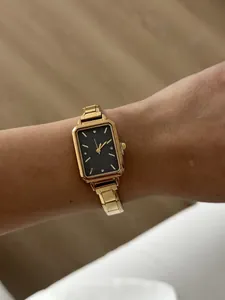 Elegant gold square quartz watch for women with a black starry dial and stainless steel strap