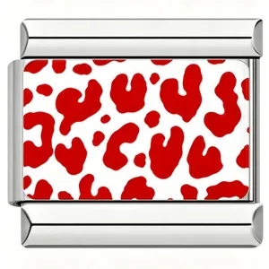 Close-up of a stainless steel bracelet charm with a red leopard print design