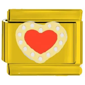 Vista detallada de un dije modular de acero inoxidable dorado con un motivo de corazón rojo