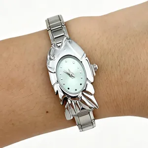 Close-up view of a unique women's fashion watch featuring a silver fish-shaped case
