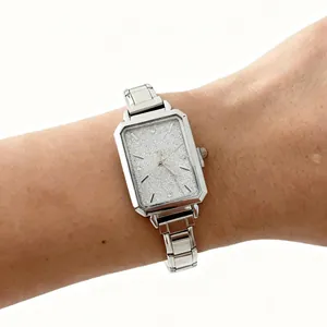 Elegant silver rectangular women's quartz watch with shimmering glitter dial and link strap