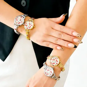 Close-up of women wearing stylish cherry-printed quartz watches with modular metal bands.