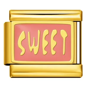 Close-up detail of a gold stainless steel modular charm with a pink sweet word design