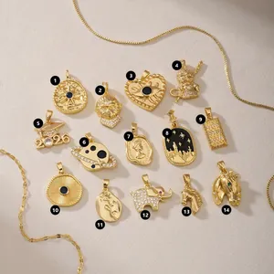 Selection of gold stainless steel charms including 2026 grad cap and elephant motifs