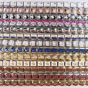 Detailed view of various DIY Italian charm modules featuring dogs hearts and scenery