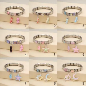 Selection of nine Italian modular stainless steel charm bracelets with ocean themed pendants.