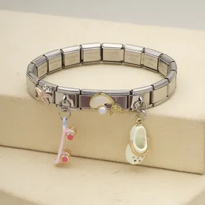 Detail of stainless steel Italian modular charm bracelet with sea star and clog charms.
