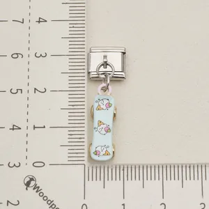 Close-up of a stainless steel Italian modular charm featuring a cute blue skateboard dangle.