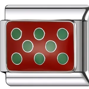 Detailed macro shot of a silver modular DIY bracelet charm with red enamel and green dots.