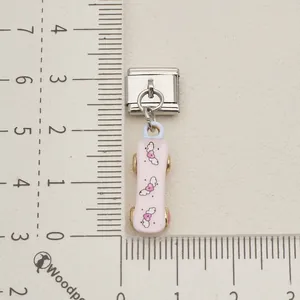 Detailed view of pink skateboard heart charm on stainless steel Italian modular link.