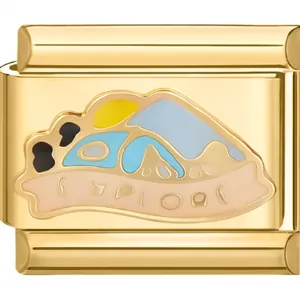 Close-up of gold Italian charm link with colorful enamel landscape design