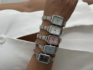Detail shot of rectangular quartz watches in five dial colors with silver steel bands.