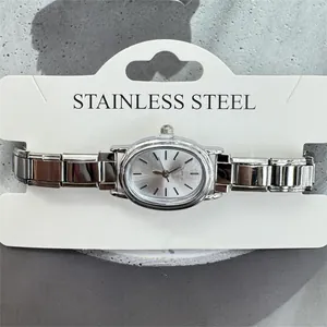 Close-up of elegant silver women's quartz watch with stainless steel modular band