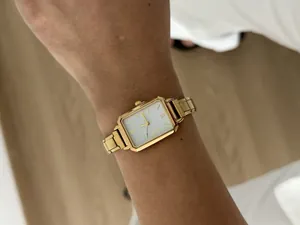 Vintage gold rectangular ladies quartz watch with white dial and metal link strap