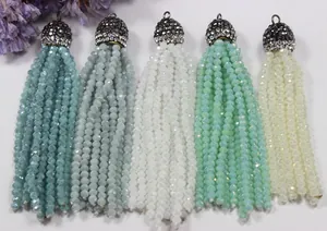 Close-up of crystal bead tassel pendants with rhinestone-studded caps in 5 colors