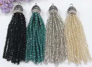 Close-up of sparkling crystal bead tassels with rhinestone caps in four colors