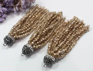 Detailed macro shot of elegant champagne crystal beaded tassels for jewelry making DIY