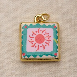 Close-up of a square copper pendant with a colorful sun design for DIY jewelry making.