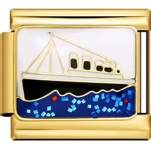 Detailed macro view of a golden DIY bracelet charm with a cruise ship enamel design