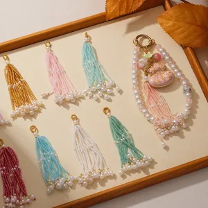 Close-up of multicolored long beaded tassels and pearl gourd keychain accessory