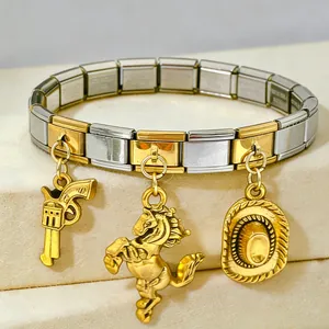 Close-up of two-tone Italian charm bracelet with cowboy gun, horse, and hat pendants