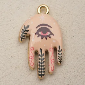 Bohemian gold-toned hand pendant with mystic eye design for unique DIY necklace jewelry