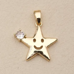 Close-up of a gold copper star pendant featuring a smiley face and a sparkling crystal stone