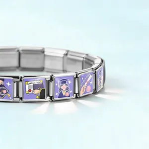 Close-up of stainless steel Italian link bracelet featuring purple graduation charms