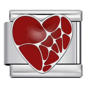 Detailed macro view of red enamel heart mosaic pattern on stainless steel Italian charm link