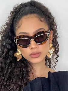 Close-up of stylish cat-eye sunglasses on female model for a luxury fashion look