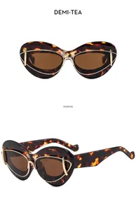 Vintage cat eye sunglasses featuring a tortoiseshell frame and elegant gold metal accents