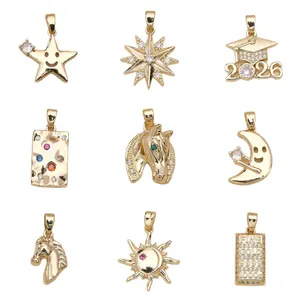 Set of 9 gold-plated copper charms featuring sun, moon, and graduation themes.