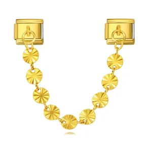 Detail view of a gold Italian modular bracelet pendant with radiating pattern charms