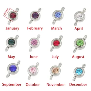 Close-up of 12 colorful birthstone double-hook connectors for DIY jewelry making