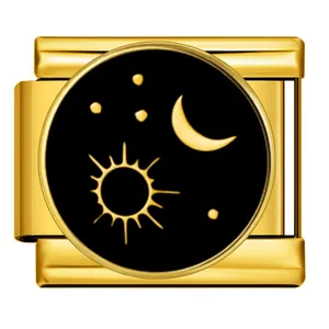 Detailed view of a gold Italian charm link with sun moon and star pattern on black