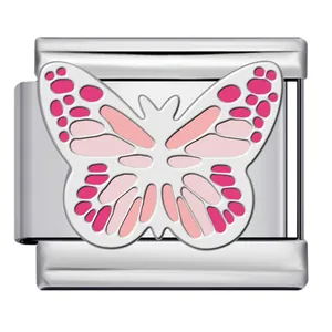 Macro view of pink butterfly enamel pattern on stainless steel Italian charm