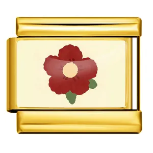 Detailed macro view of an Italian modular charm featuring a vibrant red flower on gold plating.