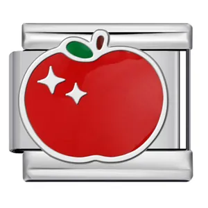 Close-up of a stainless steel Italian charm link with a red enamel apple design.