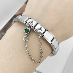 Close-up detail of silver Italian modular bracelet with a green birthstone charm and chain