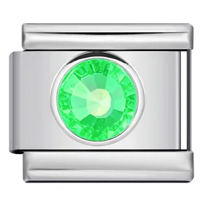 Macro view of stainless steel Italian charm link with faceted green gemstone inlay.