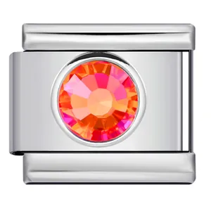 Macro view of a stainless steel Italian charm module featuring a faceted colorful gemstone