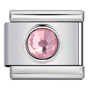 Detail view of stainless steel Italian charm link with a pink circular crystal stone.