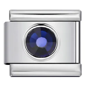 Macro detail of deep blue crystal stone set in stainless steel Italian modular charm link