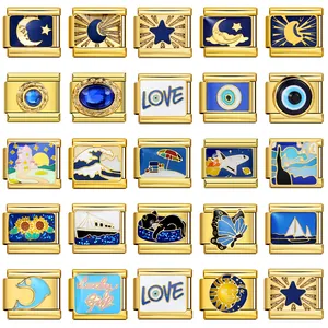 Detailed view of gold-toned Italian charm links with blue enamel celestial designs