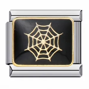 Detailed view of a stainless steel Italian charm featuring a golden spider web on black