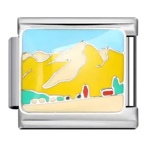Close-up view of a stainless steel Italian charm link featuring a landscape enamel design