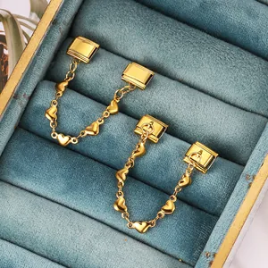 Detail of gold stainless steel heart chain link with double hooks for modular bracelets