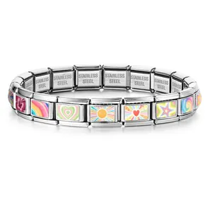 Detailed macro shot of a stainless steel Italian charm bracelet featuring colorful heart and sun patterns