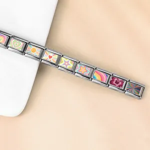 Close-up detail of a colorful stainless steel Italian charm bracelet with DIY modular links
